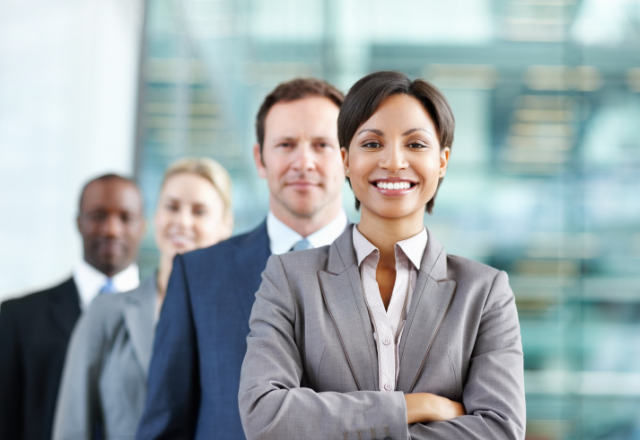 business people standing in a line and smiling