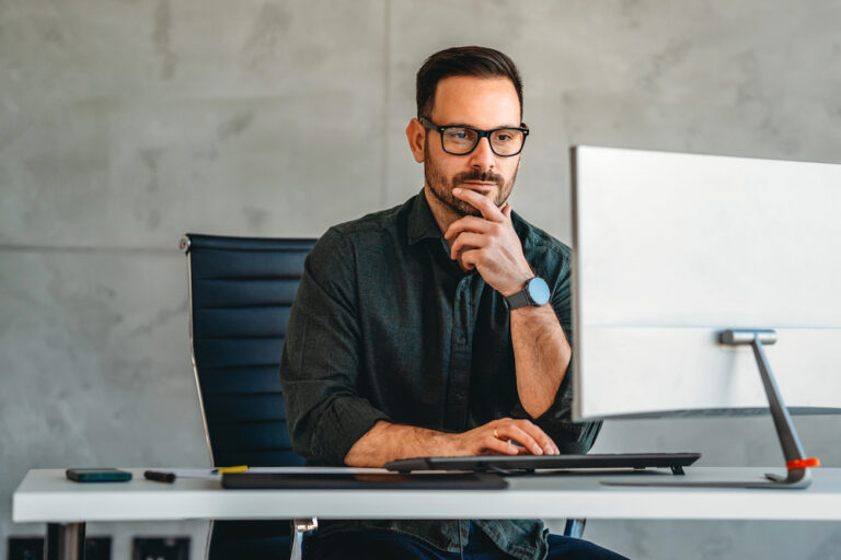 Businessman working at his desktop computer